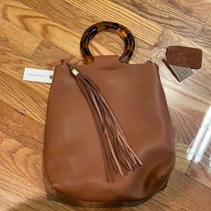 NWT Anthropologie faux leather crossbody bag with tortoise shell round handles